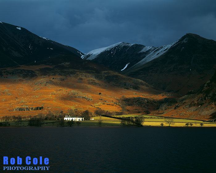 A ray of sunlight illuminates Rannerdale on a dark winter afternoon